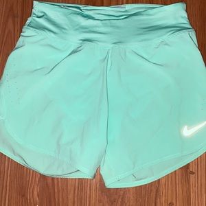 Gorgeous Nike mint color, size small running shorts